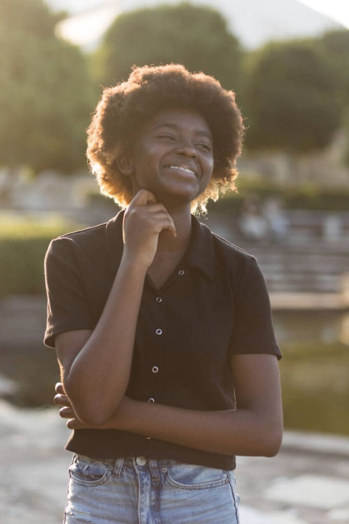 A young adult girl posing in the daylight as her hand crossed, smiling - Tokyo Portrait Photographer, Headshot photos